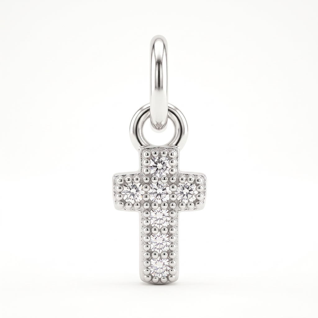 A silver cross pendant adorned with clear pavé gemstones, suspended from a matching silver bail, shown against a plain white background.