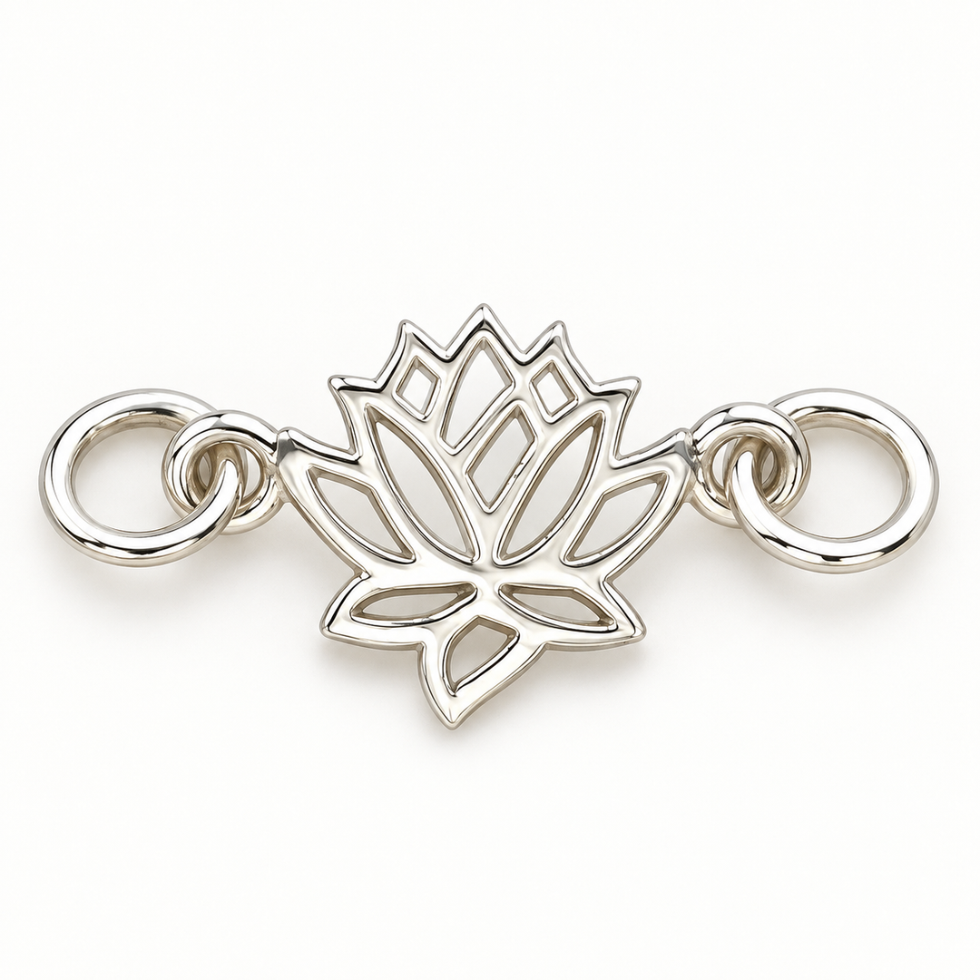 Sterling silver openwork lotus connector charm with attachment rings on both sides, front view.